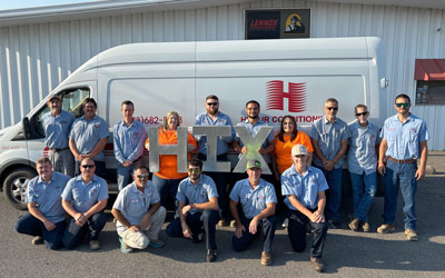 Hix Team standing in front of work van